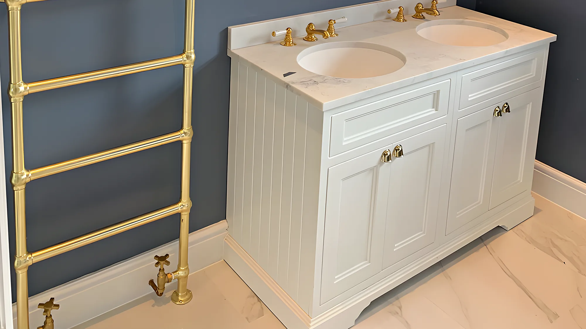 A bathroom with navy walls, a white double vanity and a brass towel rail