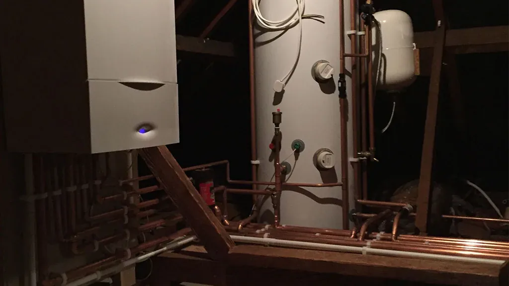A Worcester Bosch boiler and a Gledhill unvented cylinder fitted in a loft with new copper pipework